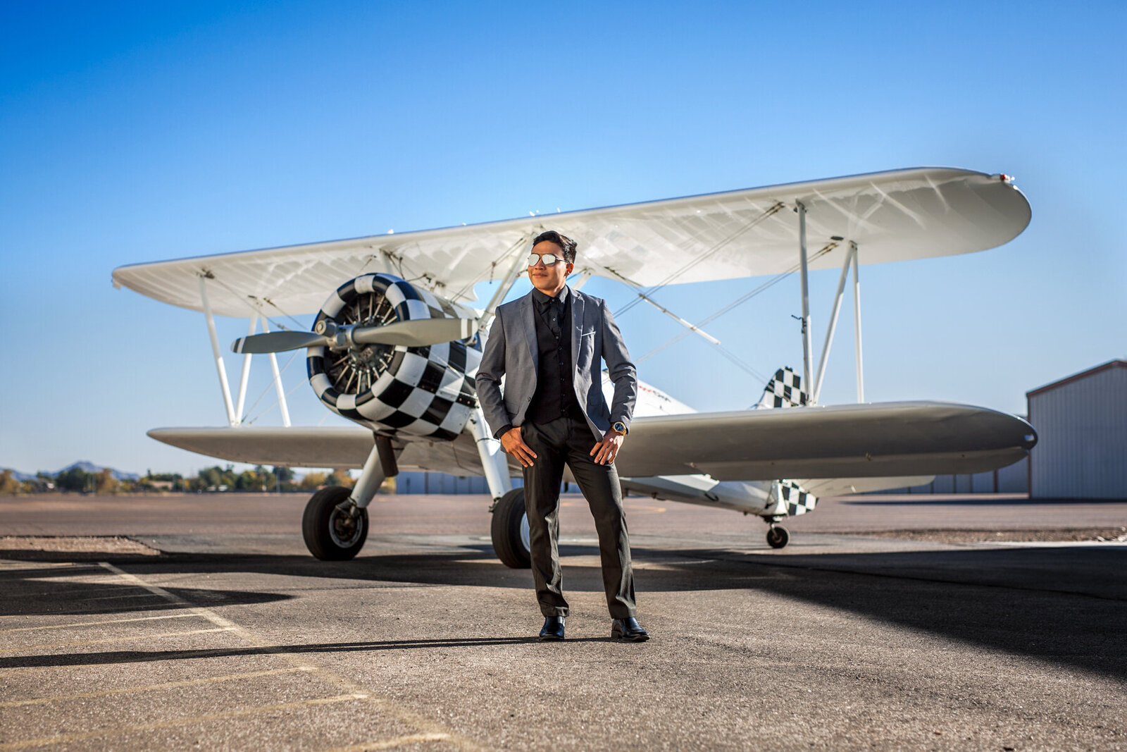 Man with vintage biplane